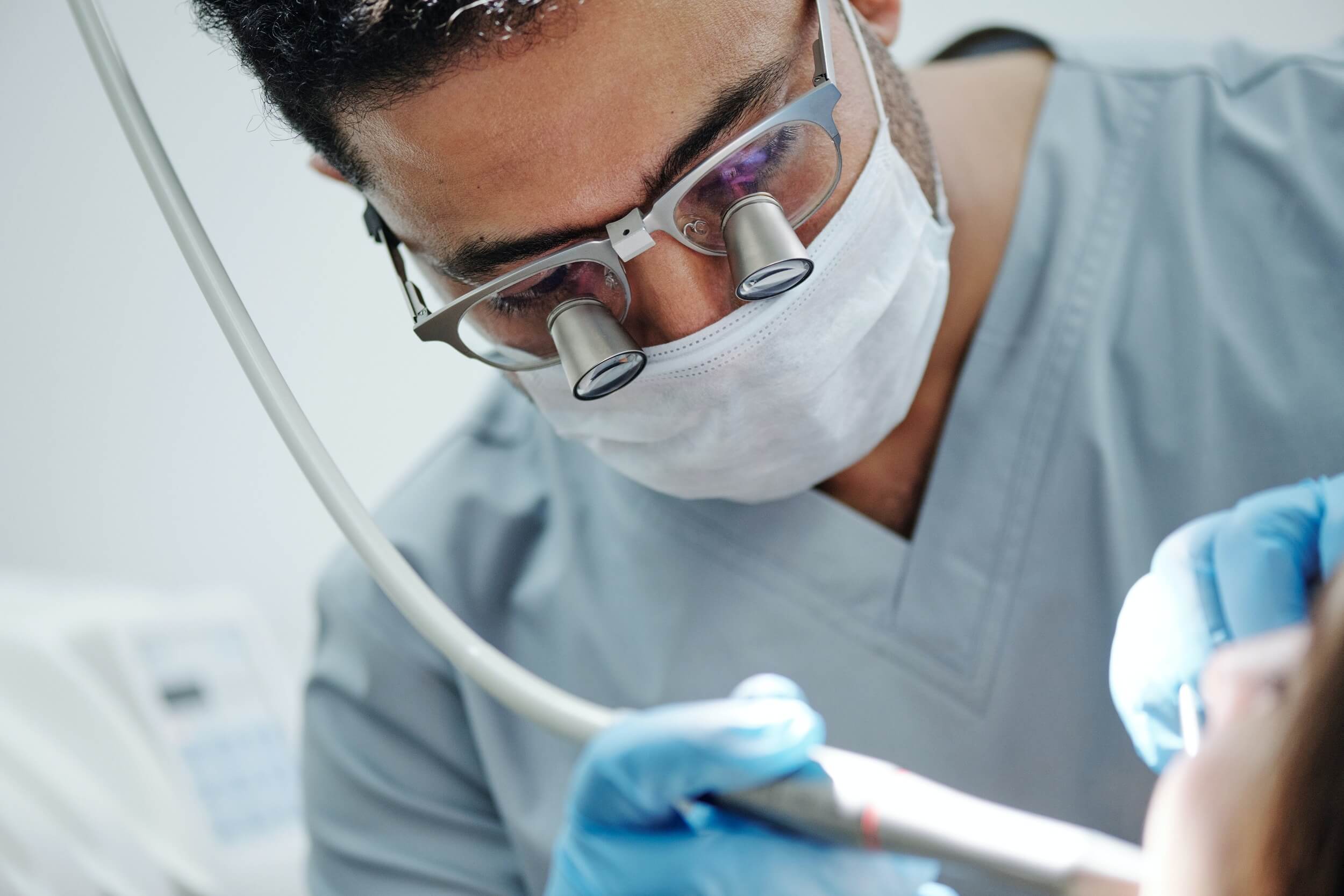 dentist performing on a patient 